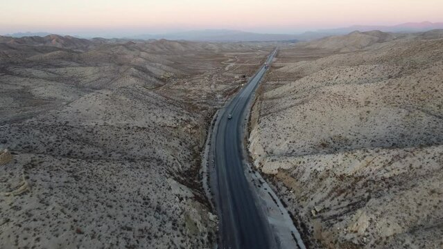 Aerial View Of car Driving Along Highway N-25 In Baluchistan. Dolly Forward. 
