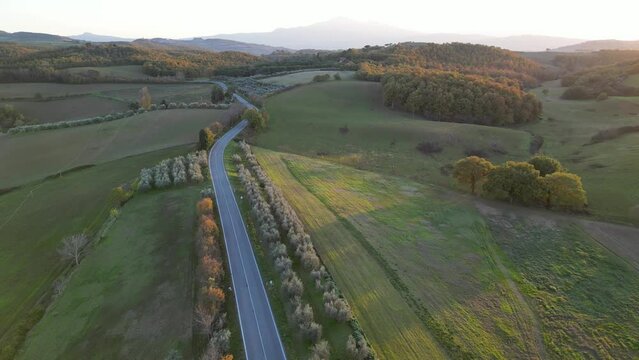 4k arieal drone video of country road in autumn Tuscany Italy