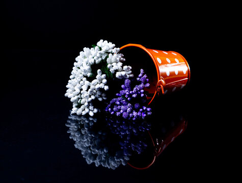 Aluminum Ice Bucket Laid In Wait For Use. Stainless Multi-colored Bucket With Green Blue Flowers