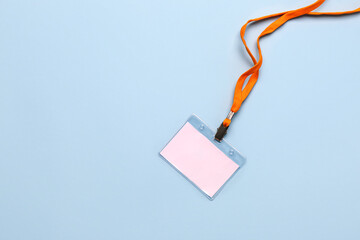 Blank badge with orange lanyard on color background