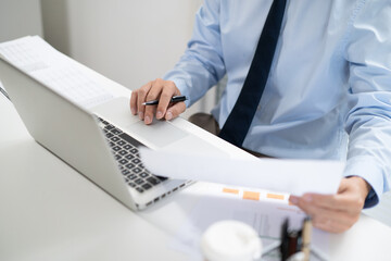 Business man working by using laptop computer Hands typing on a keyboard. Professional investor working new start up project. business planning in office. Technology business