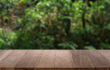 Empty wooden table in front of abstract blurred background of coffee shop . can be used for display or montage your products.Mock up for display of product