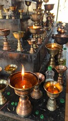 Buddhist monastery in Ladakh, India. Candles burning inside Buddhist temple, Leh, India