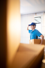 The delivery man brings the goods that the customer purchased and delivers them to the customer's home.