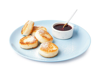 Plate with tasty cottage cheese pancakes and strawberry jam on white background