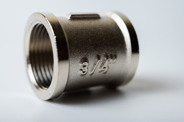 brass metal plugs, joints, adapters, hex key plugs for water isolated on light background close up plumbing connections and parts