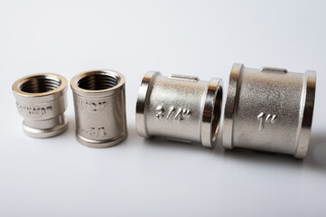 brass metal tee water adapters isolated on light background close up plumbing connections and details