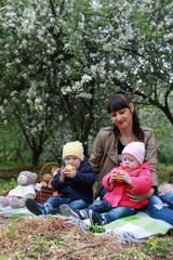 Fototapeta premium Beautiful girl in a park with children
