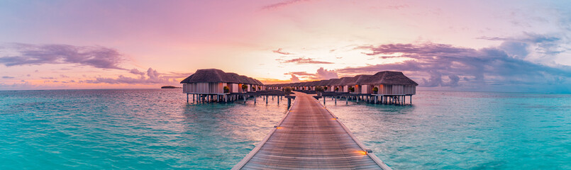 Amazing beach panoramic landscape. Beautiful Maldives sunset seascape view. Horizon colorful sea...
