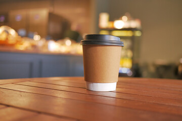 take away paper coffee cup o on cafe table
