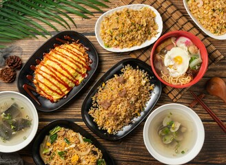 Tomato Sauce Omelet Rice, Beef, Shrimp and Egg Fried Rice, Pot Roast Pasta, sand teaserved in bowl isolated on table top view of taiwan food