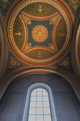 Monumental church building in Gothic in neo-romanesque arch style with large ceiling and altar...