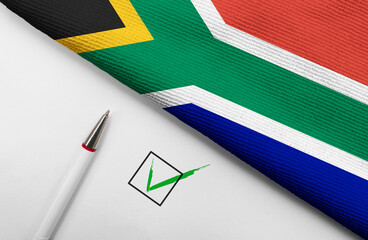 pencil, flag off South Africa and check mark on paper sheet
 - obrazy, fototapety, plakaty