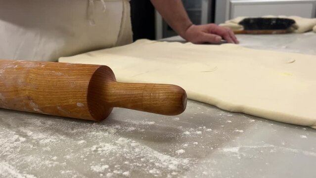 Pastry chef prepares puff  pastry in his artisanal worshop in Jerica, Spain.