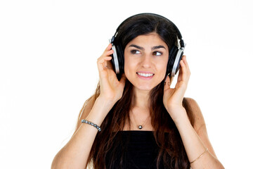 young happy smiling woman with headphones listen music dreaming