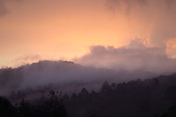 mist covered mountain at sunrise