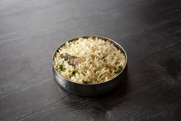 A view of a balti bowl of jeera matar pulao.