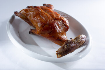 A view of a plate of roasted Peking duck.