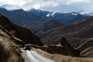 car on mountain road in new zealand