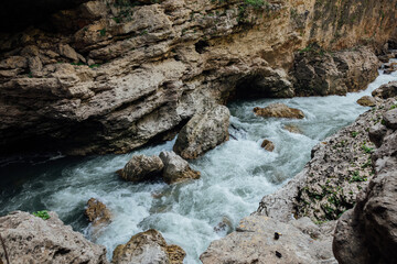 mountain river in the forest among the rocks of the rock and nature hiking journey