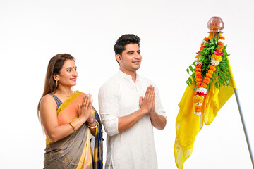 Indian Couple praying and celebrating Gudi Padwa festival. gudi padwa is marathi new year.