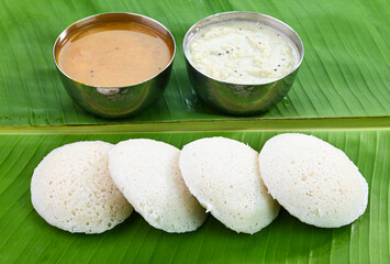 Idli South Indian breakfast served with chutney and sambar. 