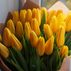 Beautiful spring delicate bouquet of yellow tulips. Spring and Women's Day
