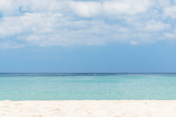 Fototapeta na wymiar Bright sand beach, sea and beautiful sky with clouds
