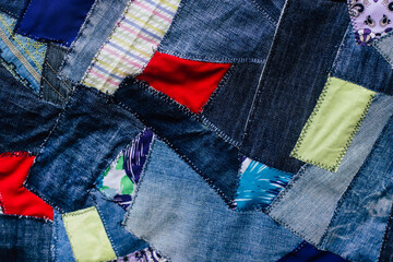 jeans fabric pieces sewn in different shapes and shades fragment, denim patchwork, needlework
