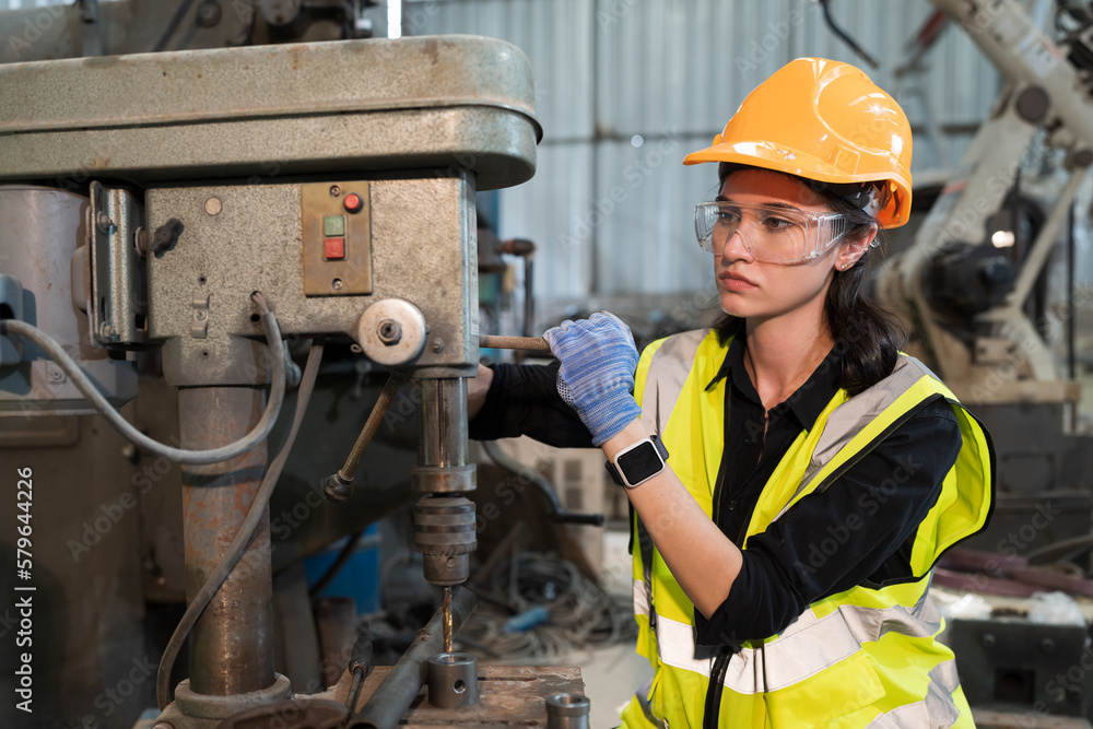 Aufkleber Female engineer working with lathe machine in factory. Industry for manufacturing technology