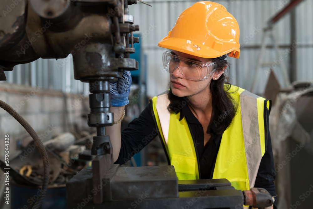 Poster female engineer working with lathe machine in factory. industry for manufacturing technology