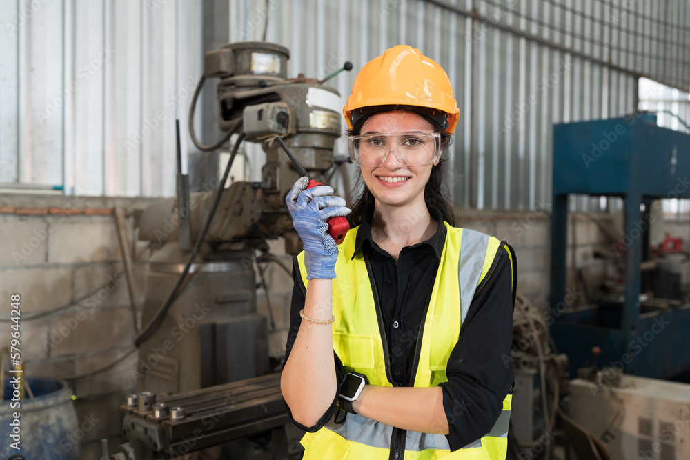 Poster Female engineer working in lathe machine factory. Industry for manufacturing technology