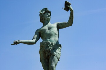 Low angle view of statue against blue sky at Le Jardin du Luxembourg during sunny day