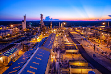 High angle view of illuminated petrochemical plant against blue sky at Permian Basin