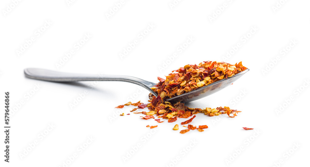 Poster dry chili pepper flakes in spoon. crushed red peppers isolated on white background.