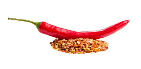 Dry chili pepper flakes and chili peppers. Crushed red peppers isolated on white background.