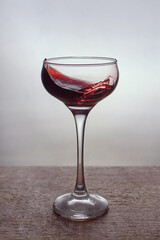 Red wine splash in a glass