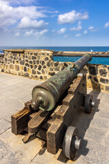 Fototapeta na wymiar Old cannons at fort Bateria de Santa Barbara guarding the harbour entrance in Puerto de la Cruz, Tenerife.