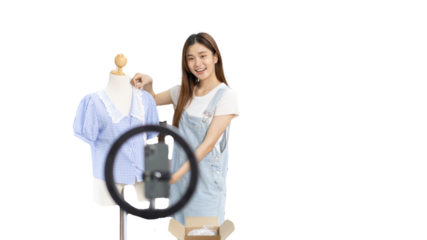Beautiful woman with social media influences performing live or recording shows selling cheap fashion clothes in her studio, Recording vlog video live streaming, Online fashion clothing business.
