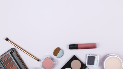 set of professional decorative cosmetics, makeup tools and accessories on a color background....