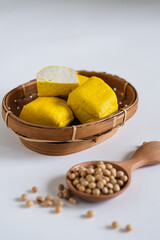 raw yellow tofu isolated white background