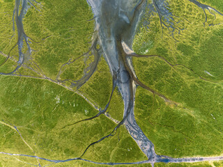 An aerial view of a winding river and the surrounding landscape, a unique perspective of the natural environment.