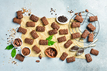 Delicious chocolate covered cookies with nuts. Top view. On a gray stone background. Space for text.