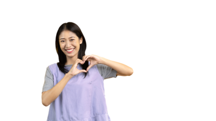 Asian young woman with bright smile making heart symbol shape with hands, Symbol of love and romance, Give each other cuteness and create smiles for each other, Positive thinking concept.