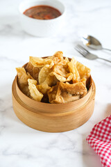 batagor is Indonesian dish like fried dumplings, served in peanut sauce and chili