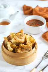batagor is Indonesian traditional food , fried fish dumpling with peanut sauce