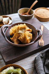 batagor is Indonesian dish like fried dumplings, served in peanut sauce and chili
