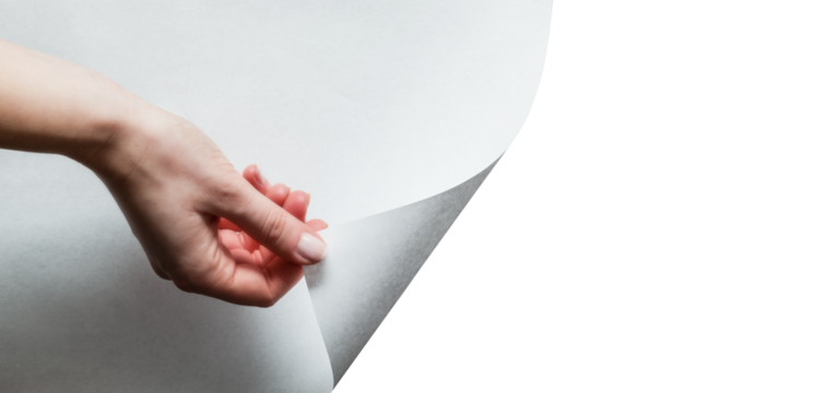 Hand pulling white page to reveal and show your design. Transparent background