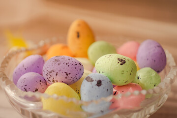 Multi colors Easter eggs in the glass plate. Pastel color Easter eggs. Close up view.