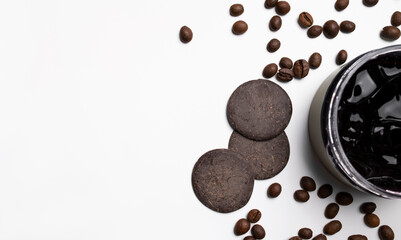Natural eco cosmetics. Body scrub, chocolate mask, cream, coffee beans and cocoa on light...